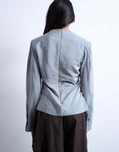 Model wearing Long sleeve ruched side top in grey