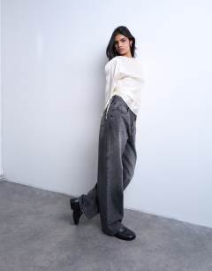 Model wearing Long sleeve ruched side top in white