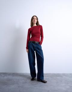 Model wearing Long sleeve ruched slash neck top in dark red