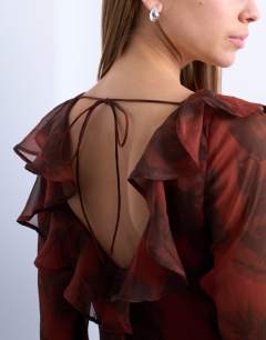 Model wearing Long sleeve ruffle maxi dress in blurred rusty floral