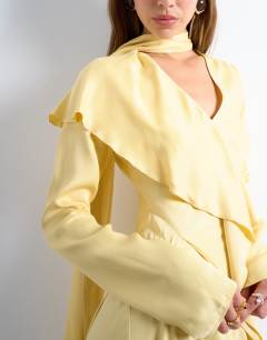 Model wearing Long sleeve ruffle maxi dress with scarf wrap detail in buttermilk