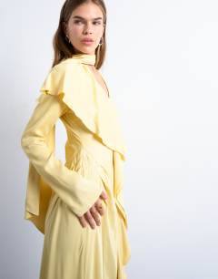 Model wearing Long sleeve ruffle maxi dress with scarf wrap detail in buttermilk