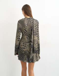 Model wearing Long sleeve ruffle mini dress with scarf wrap detail in abstract woodgrain print