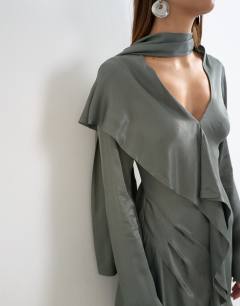 Model wearing Long sleeve ruffle mini dress with scarf wrap detail in petrol blue