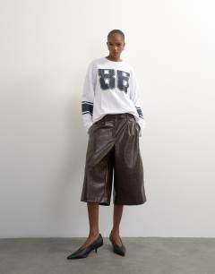 Model wearing Long sleeve skater '92' graphic t-shirt in white