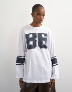 Model wearing Long sleeve skater '92' graphic t-shirt in white