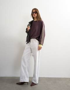 Model wearing Long sleeve skater stripe detail t-shirt in chocolate