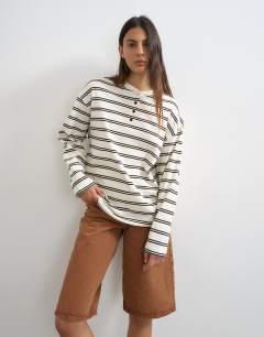 Model wearing Long sleeve striped henley in mono