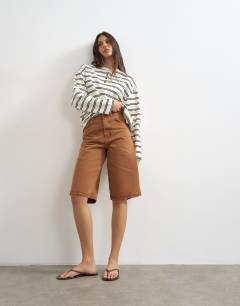 Model wearing Long sleeve striped henley in mono