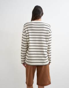 Model wearing Long sleeve striped henley in mono