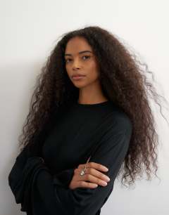Model wearing Long sleeve tie front top in black