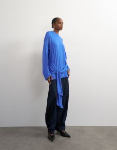 Model wearing Long sleeve tie front top in mid blue
