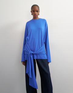 Model wearing Long sleeve tie front top in mid blue