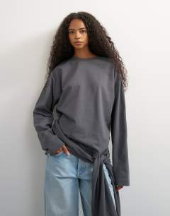 Model wearing Long sleeve tie waist detail top in charcoal