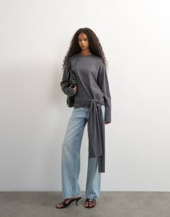 Model wearing Long sleeve tie waist detail top in charcoal