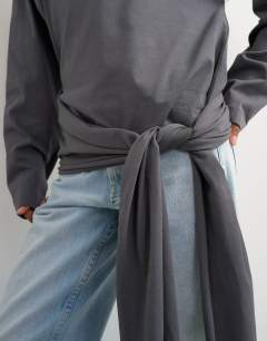 Model wearing Long sleeve tie waist detail top in charcoal