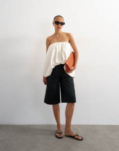 Model wearing Longline bermuda cargo short in black
