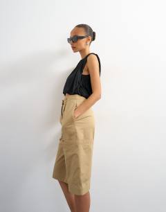 Model wearing Longline bermuda cargo short in ecru