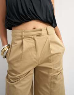 Model wearing Longline bermuda cargo short in ecru