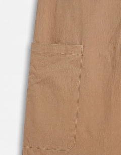 Model wearing Longline bermuda cargo short in ecru