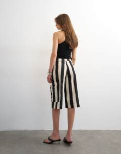 Model wearing Longline bermuda cargo short in mono stripe