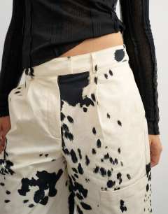 Model wearing Longline bermuda short in ink smudge