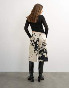 Model wearing Longline bermuda short in ink smudge
