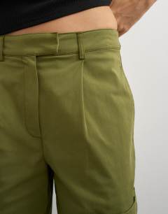 Model wearing Longline bermuda short in khaki