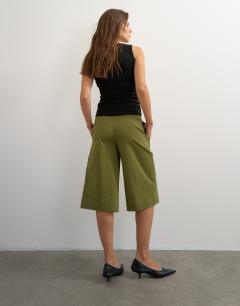 Model wearing Longline bermuda short in khaki