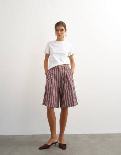 Model wearing Longline bermuda short in stripe