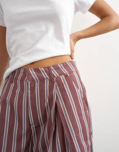 Model wearing Longline bermuda short in stripe