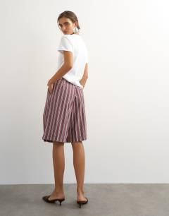 Model wearing Longline bermuda short in stripe