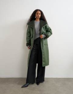 Model wearing Longline borg coat in green