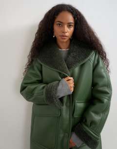 Model wearing Longline borg coat in green