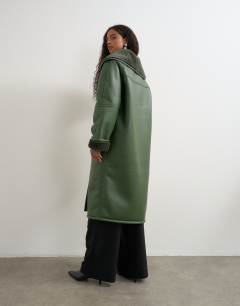 Model wearing Longline borg coat in green