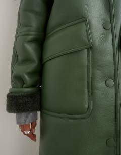 Model wearing Longline borg coat in green