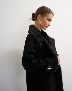 Model wearing Longline borg trim funnel neck coat in black
