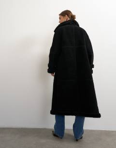 Model wearing Longline borg trim funnel neck coat in black