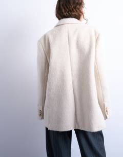 Model wearing Longline brushed one button blazer coat with wool in cream