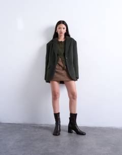 Model wearing Longline brushed one button blazer coat with wool in khaki