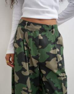 Model wearing Longline cargo short in camo