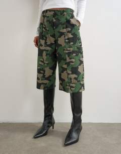 Model wearing Longline cargo short in camo