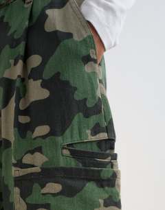 Model wearing Longline cargo short in camo