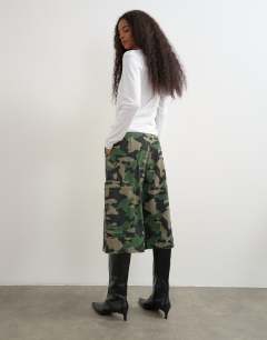 Model wearing Longline cargo short in camo