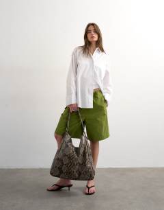 Longline cargo short with bungee cords in green