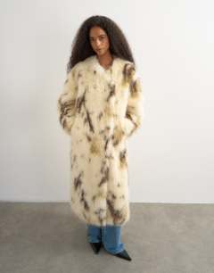 Model wearing Longline faux fur coat in cow