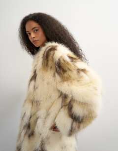 Model wearing Longline faux fur coat in cow