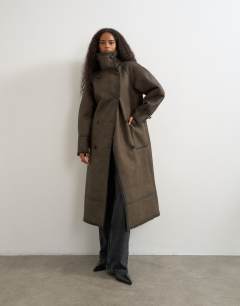 Model wearing Longline faux leather funnel neck coat in brown