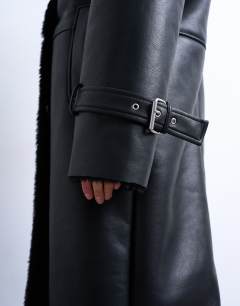 Model wearing Longline funnel oversized aviator borg coat in black