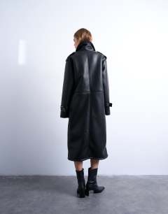Model wearing Longline funnel oversized aviator borg coat in black